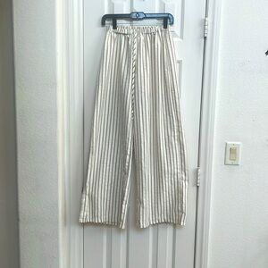 WOMAN’S CREAM COLORED (Thin red and blue striped) wide legged baggy linen pants.